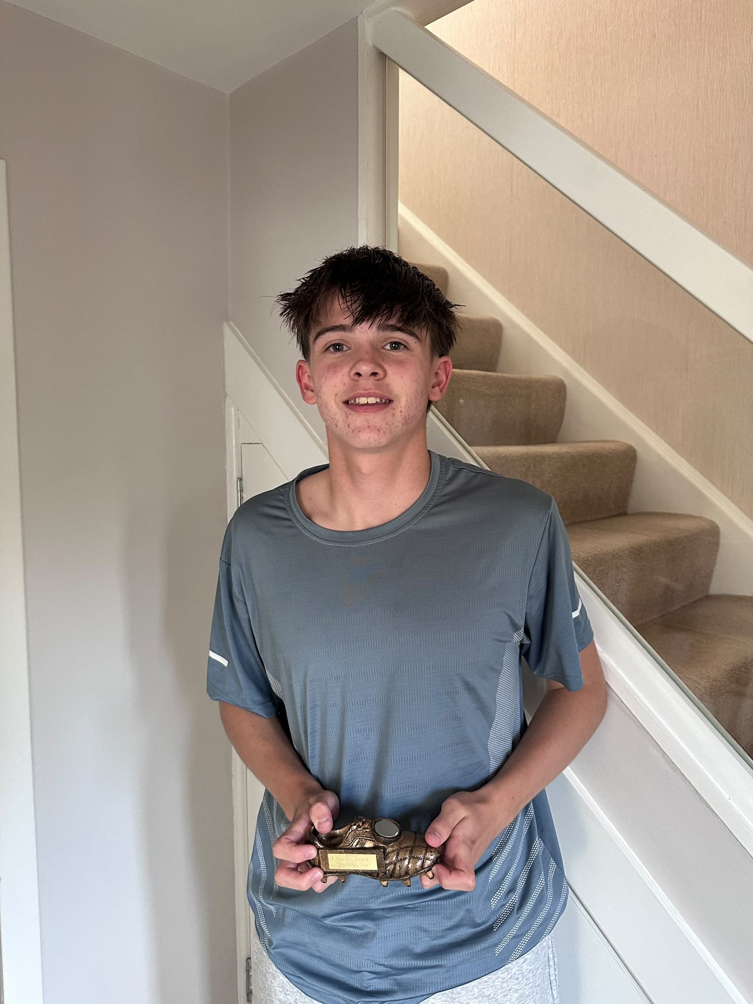 City’s coaches’ award winner holding his trophy